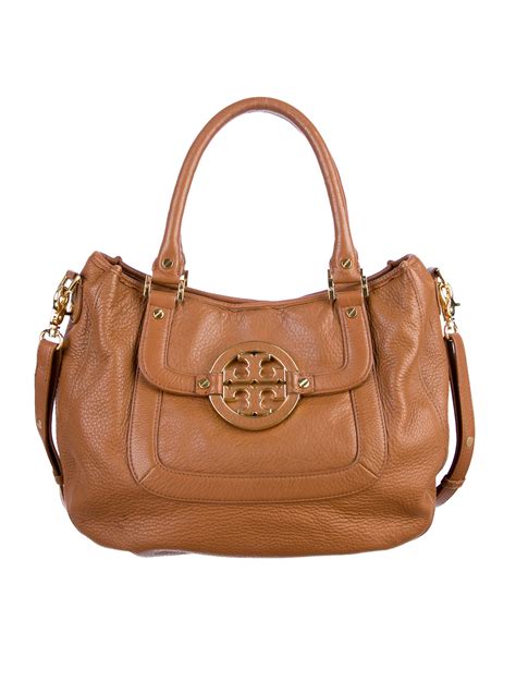 It comes with two handles, a top handle, and a longer detachable strap - perfect. . Tory burch purse wallet